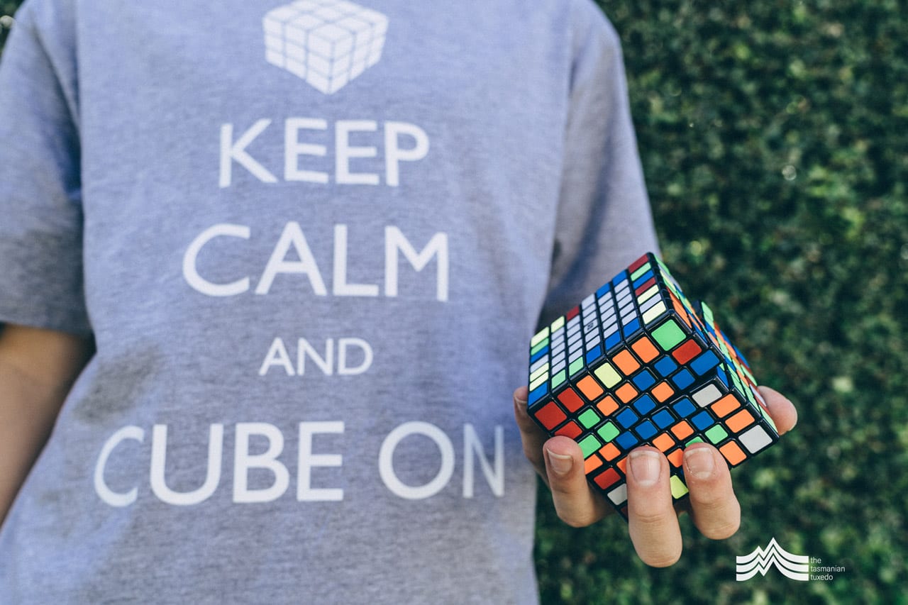 George holding a rubiks cube and wearing a Keep calm and Cube on T-Shirt