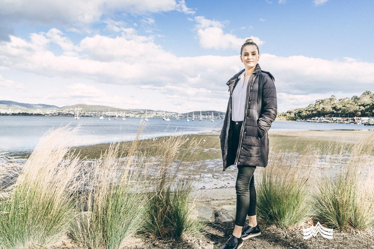 Gemma Nester from Positive Bod Squad standing in front of the Derwent River Tasmania